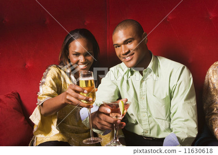 African couple toasting with cocktails African couple toasting with cocktails 11630618