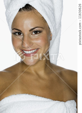 Woman wearing towel on head Woman wearing towel on head 11630626