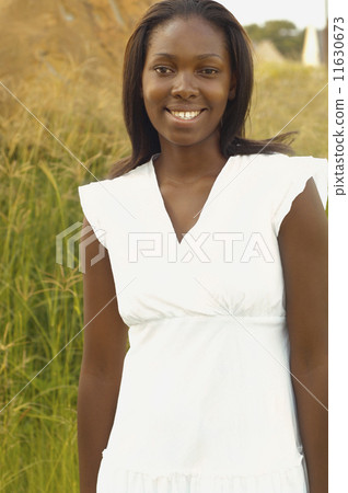 African woman smiling outdoors African woman smiling outdoors 11630673