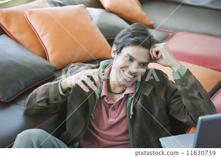 Hispanic man looking at laptop 11630739