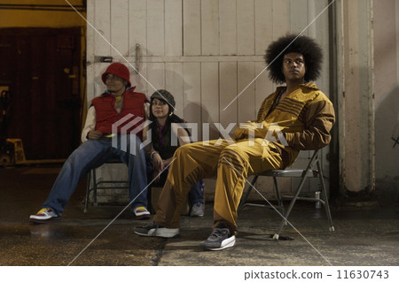Multi-ethnic breakdancers in warehouse 11630743