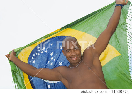 African man holding up beach wrap 11630774