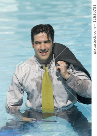Hispanic businessman in swimming pool 11630781