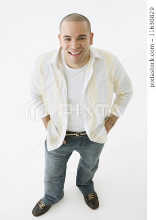 African American man with hands in pockets 11630829