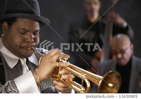 African man playing trumpet 11630905
