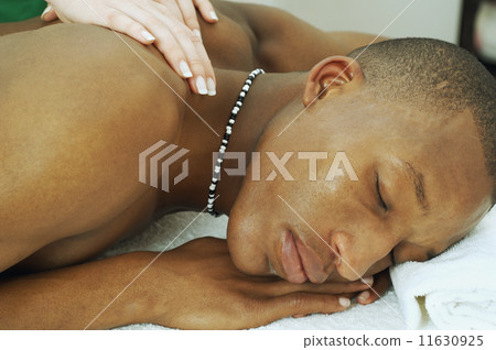 African man receiving massage 11630925