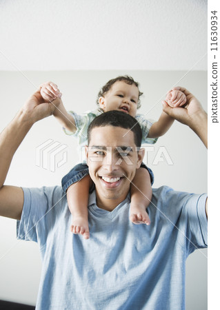 Young African father with baby on shoulders 11630934