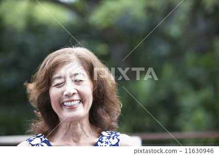 Senior Asian woman laughing 11630946