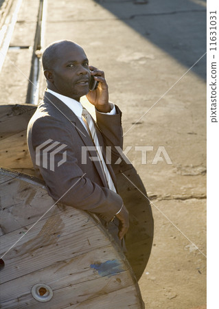African American businessman talking on cell phone 11631031