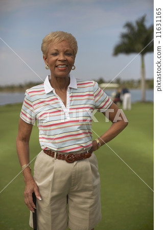 Senior African American woman on golf course 11631165