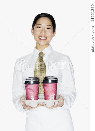 Asian female server holding to-go coffees 11631230