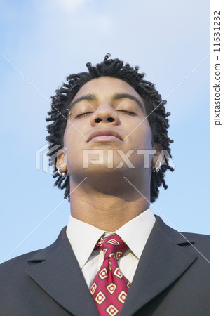African businessman with eyes closed African businessman with eyes closed 11631232