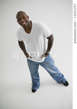 African man with hands in pockets 11631257