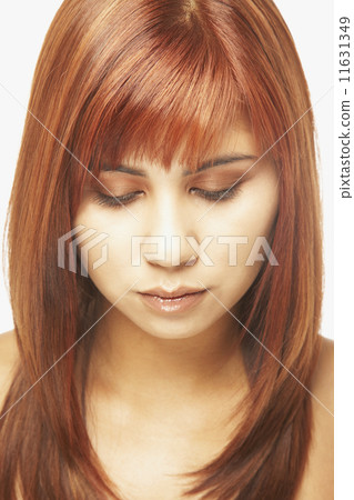 Asian woman looking down Asian woman looking down 11631349