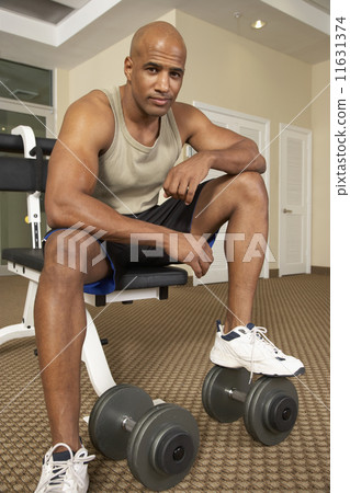 Mixed Race man at health club 11631374