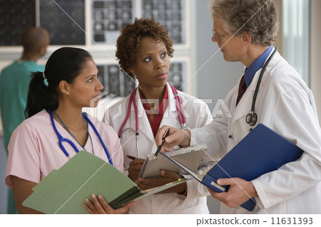 Doctors and nurse talking 11631393
