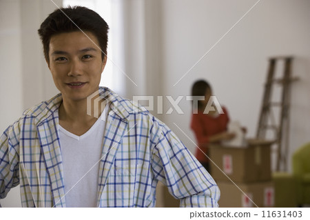 Asian man wife with packing in background 11631403
