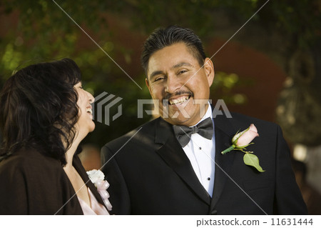 Hispanic couple in evening wear Hispanic couple in evening wear 11631444