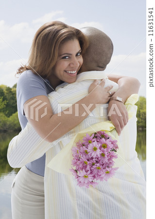 African American couple hugging 11631541