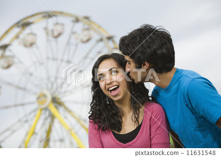Multi-ethnic teenaged couple at carnival Multi-ethnic teenaged couple at carnival 11631548
