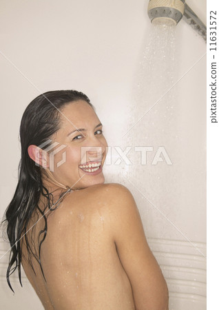 Woman smiling in shower 11631572