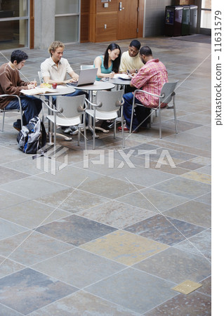 College students studying at table 11631579