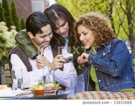 Hispanic friends looking at camera 11631668