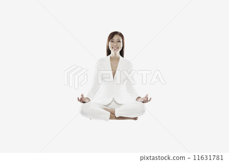 Asian woman meditating 11631781