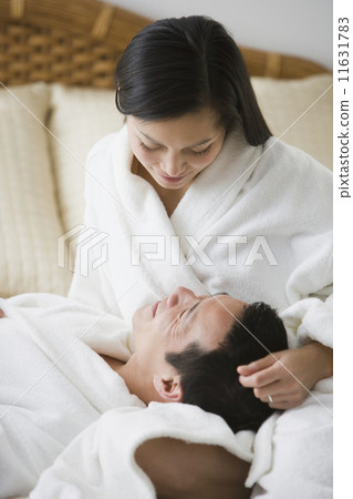 Asian couple smiling at each other 11631783