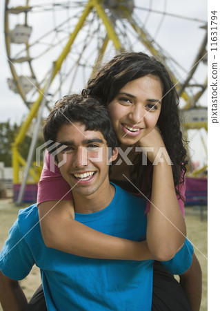 Multi-ethnic teenaged couple at carnival 11631794