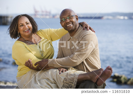 African American couple hugging 11631810