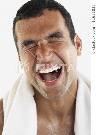 Hispanic man yawning 11631833