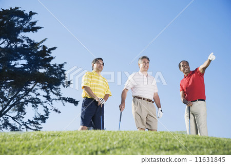 Multi-ethnic men on golf course 11631845