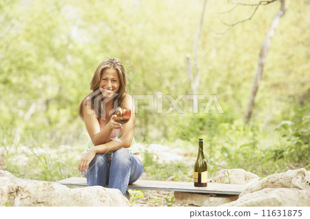 Portrait of woman holding wineglass 11631875