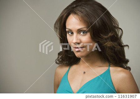 Hispanic woman wearing necklace Hispanic woman wearing necklace 11631907