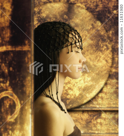 Young woman wearing head beads Young woman wearing head beads 11631980