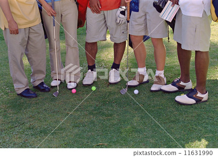Multi-ethnic friends on golf course Multi-ethnic friends on golf course 11631990