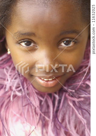 Close up of young African girl smiling 11632025