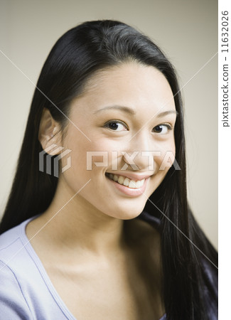 Close up of Pacific Islander woman smiling 11632026