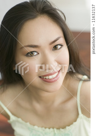 Close up of Asian woman smiling 11632137
