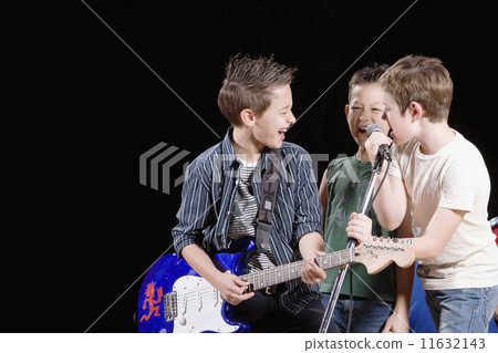 Multi-ethnic boys performing in band Multi-ethnic boys performing in band 11632143