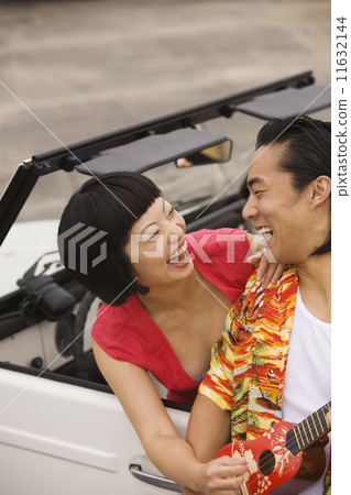 Asian couple laughing 11632144