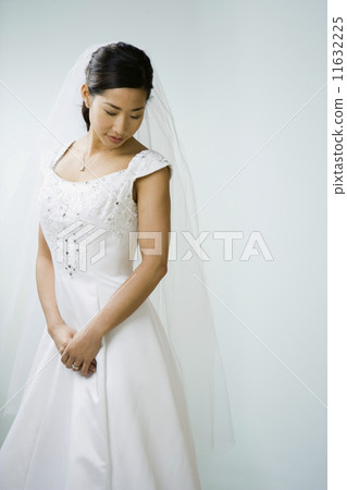 Asian bride looking down Asian bride looking down 11632225