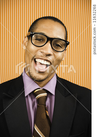 Young businessman wearing geeky glasses Young businessman wearing geeky glasses 11632268