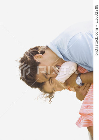 Hispanic father hugging daughter Hispanic father hugging daughter 11632289