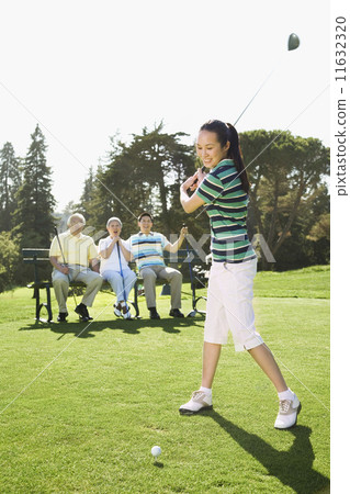 Asian woman playing golf 11632320