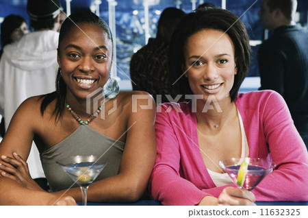 Portrait of two African women with cocktails 11632325