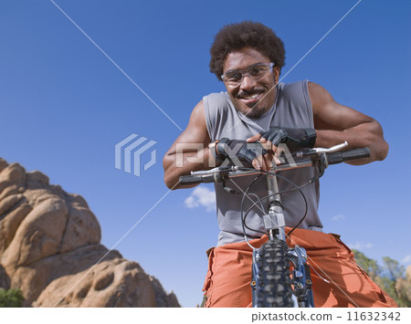 African man on mountain bike 11632342