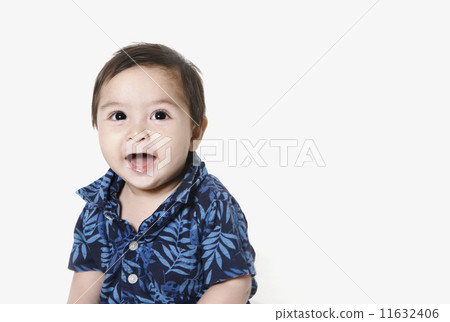 Studio shot of toddler boy smiling 11632406