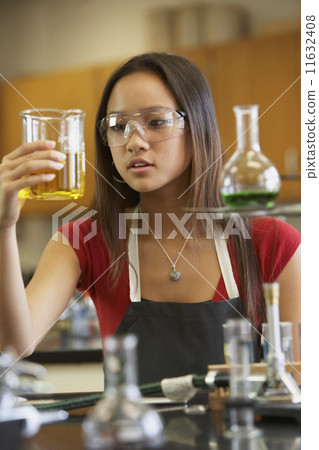 Asian teenaged girl in science class 11632408